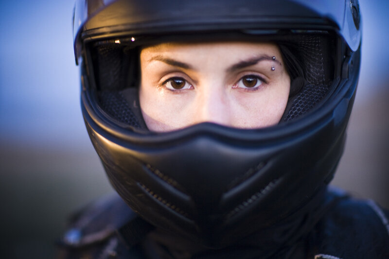 woman in motorcycle helmet