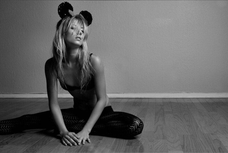 woman in mouse ears sitting on floor