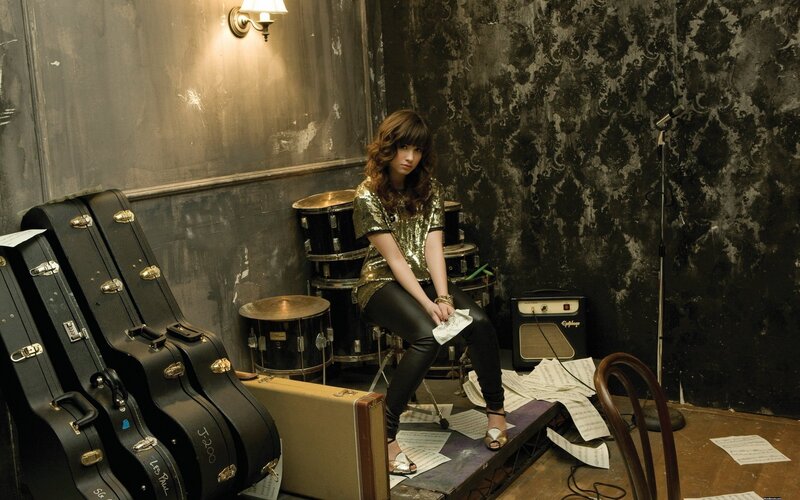 woman in music room with instruments