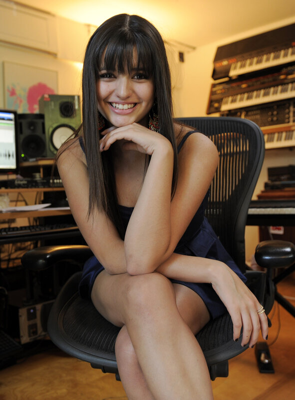 woman in music studio smiling