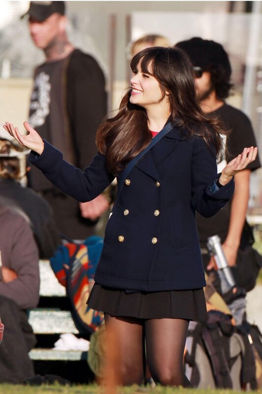 Woman in navy coat smiling