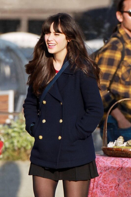 woman in navy coat smiling