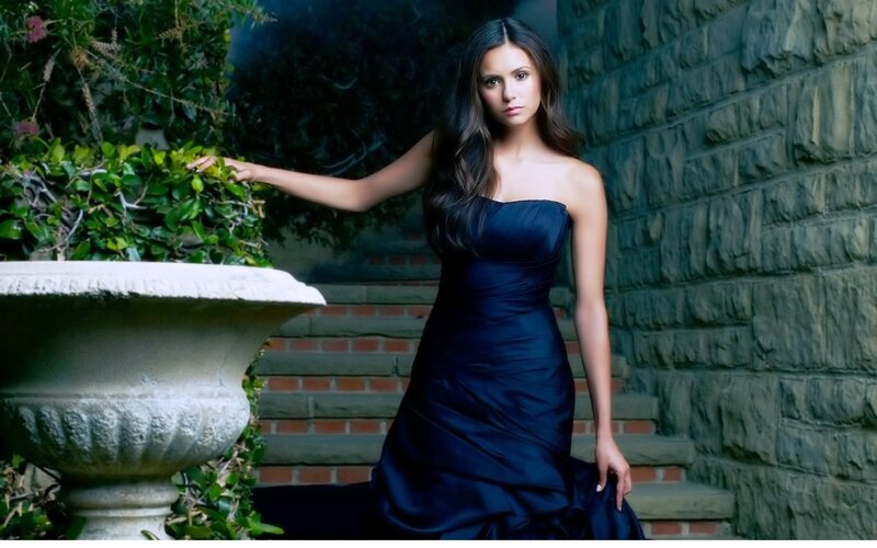 woman in navy dress on steps
