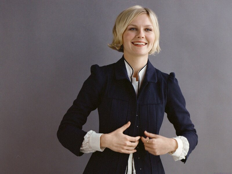 woman in navy jacket smiling