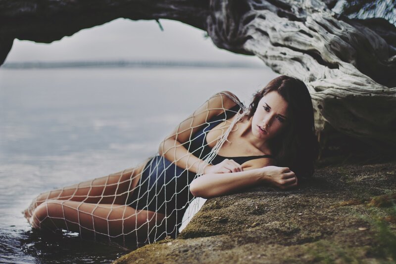 woman in net by the water