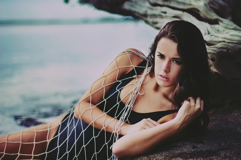 woman in net by the water