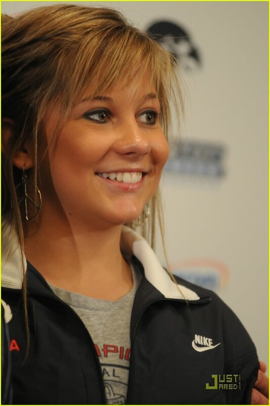 woman in nike jacket smiling