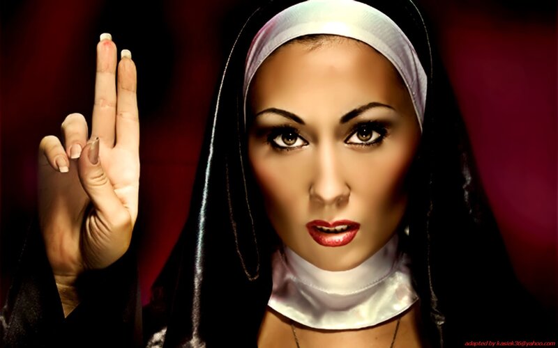 woman in nun habit making hand gesture