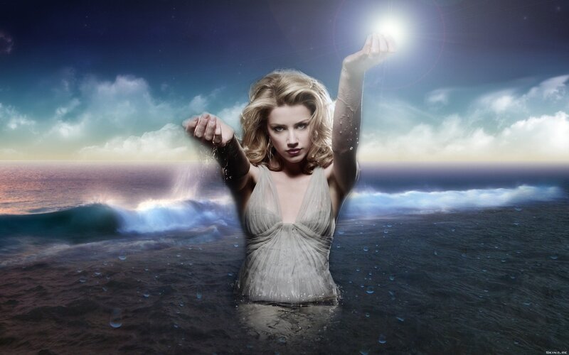 woman in ocean with light