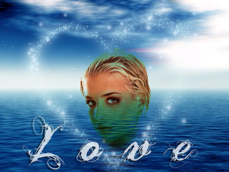 woman in ocean with love text