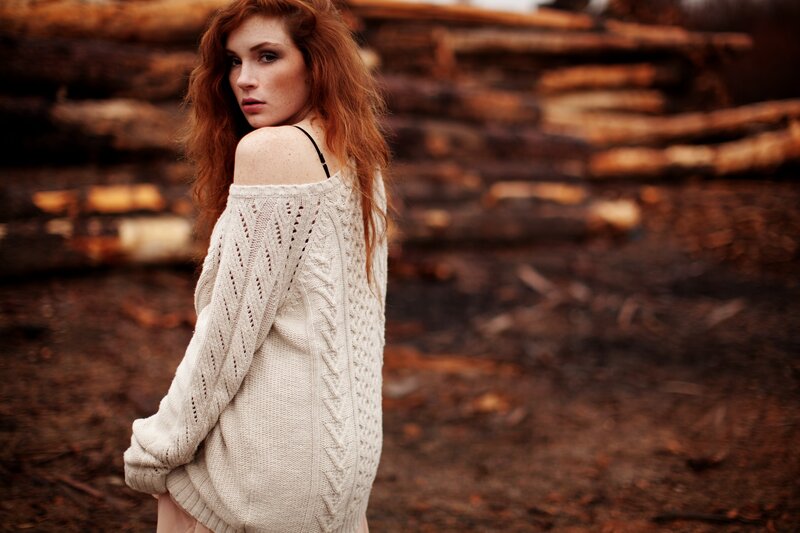 Woman in off-shoulder sweater