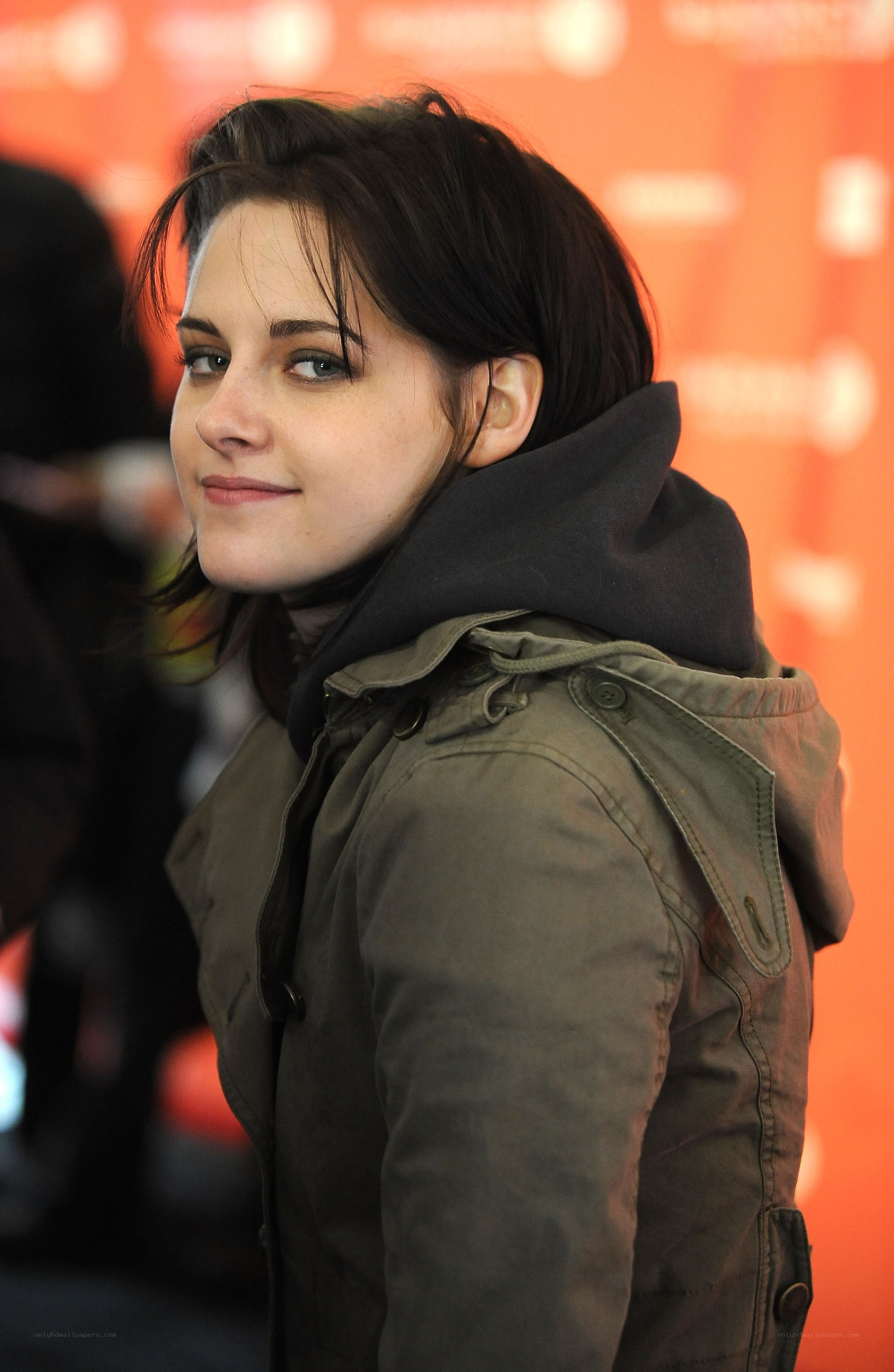 woman in olive jacket