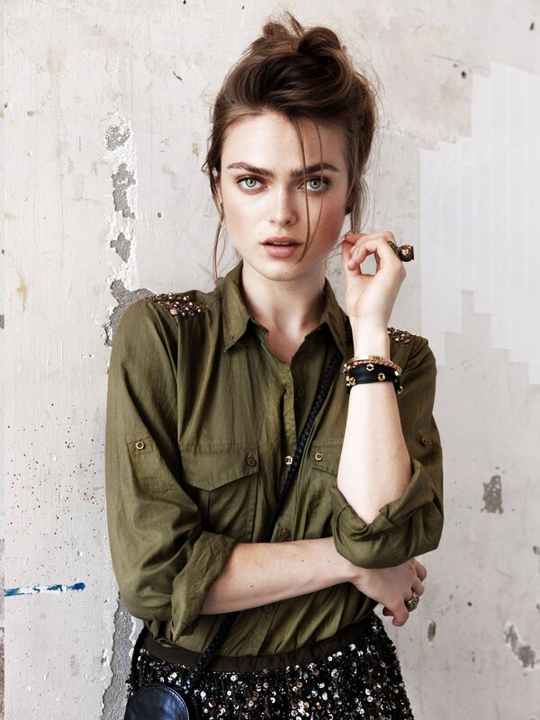 Woman in olive shirt with sequins