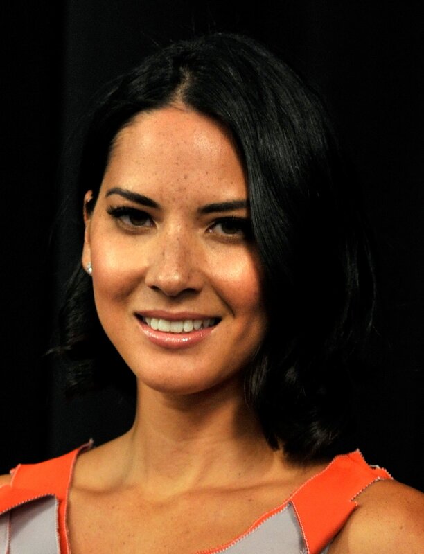 woman in orange and grey top
