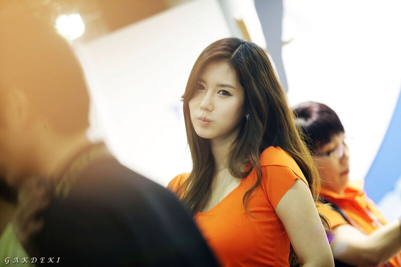 woman in orange at event