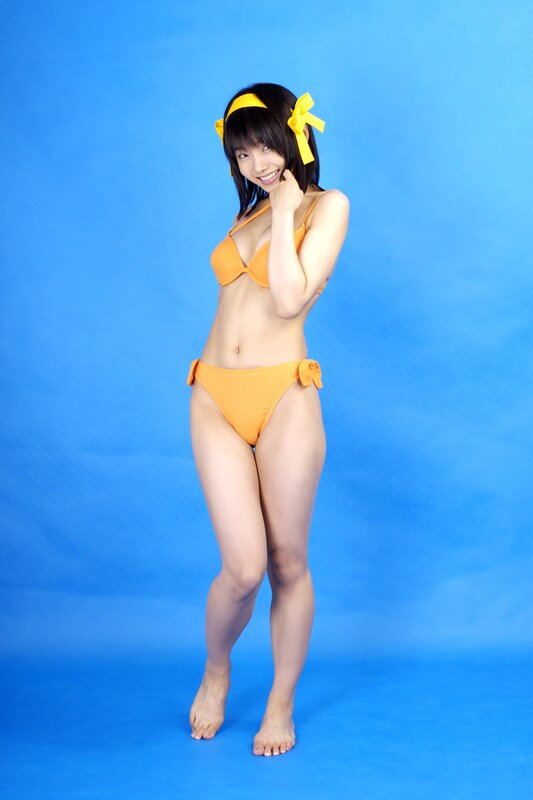 Woman in Orange Bikini — Blue, Playful, Photograph, Yellow Bow