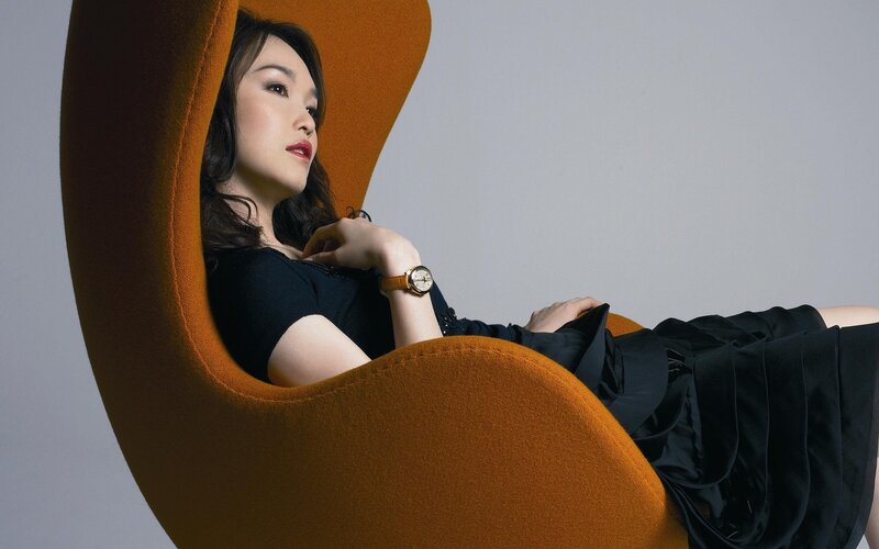 woman in orange chair