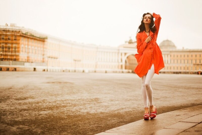 Woman in Orange Coat — Dramatic, Photograph