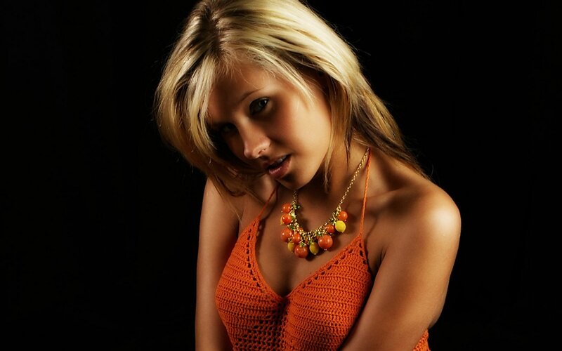 woman in orange crochet top