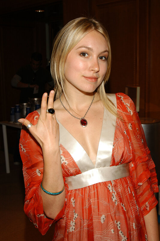 woman in orange dress at event