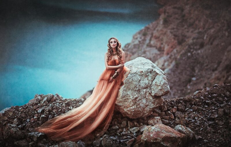 Woman in Orange Dress — Dramatic, Photograph, Rock