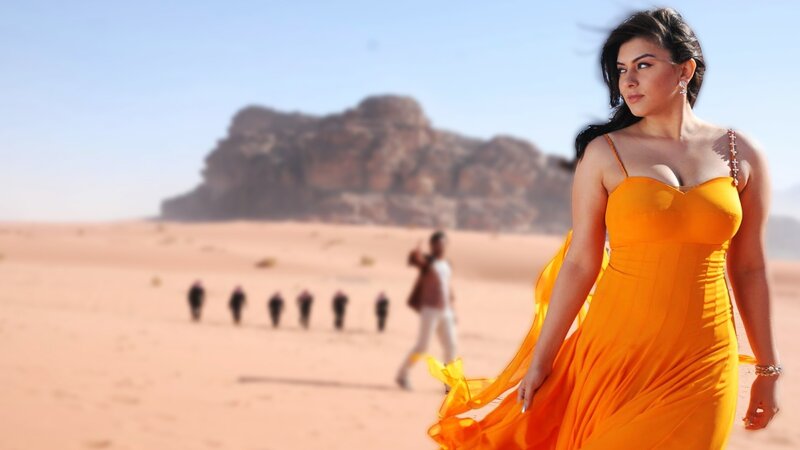 Woman in orange dress in desert