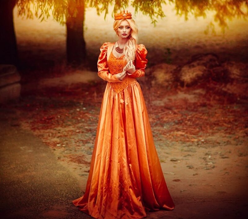 Woman in Orange Gown — Dramatic, Sunset, Photograph