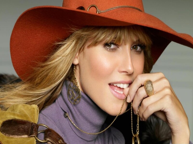 woman in orange hat smiling