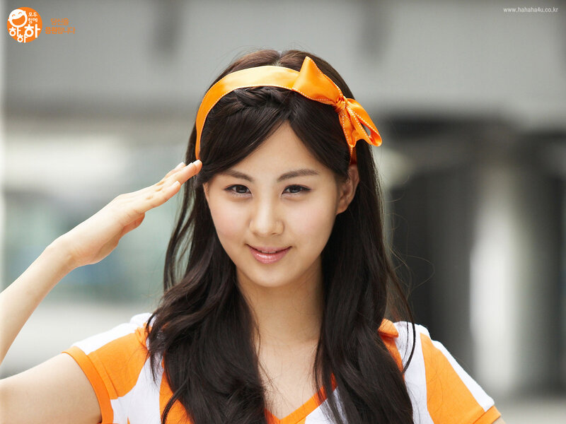 woman in orange headband saluting