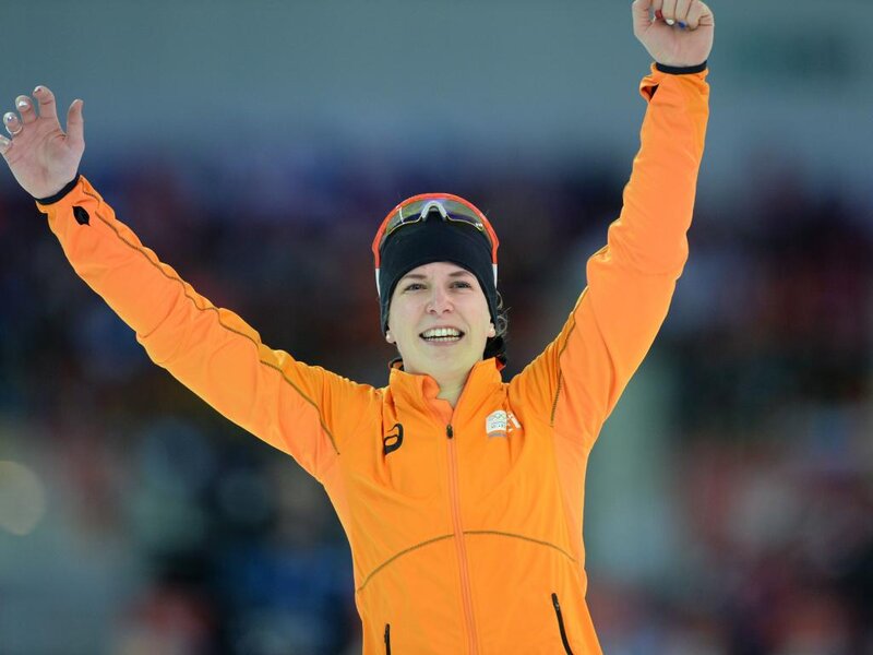 Woman in Orange Jacket — Celebratory