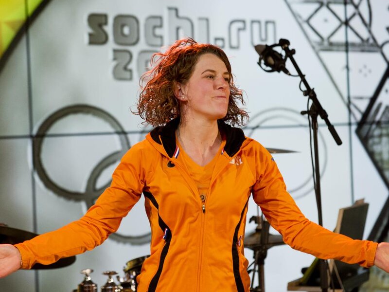Woman in Orange Jacket — Energetic