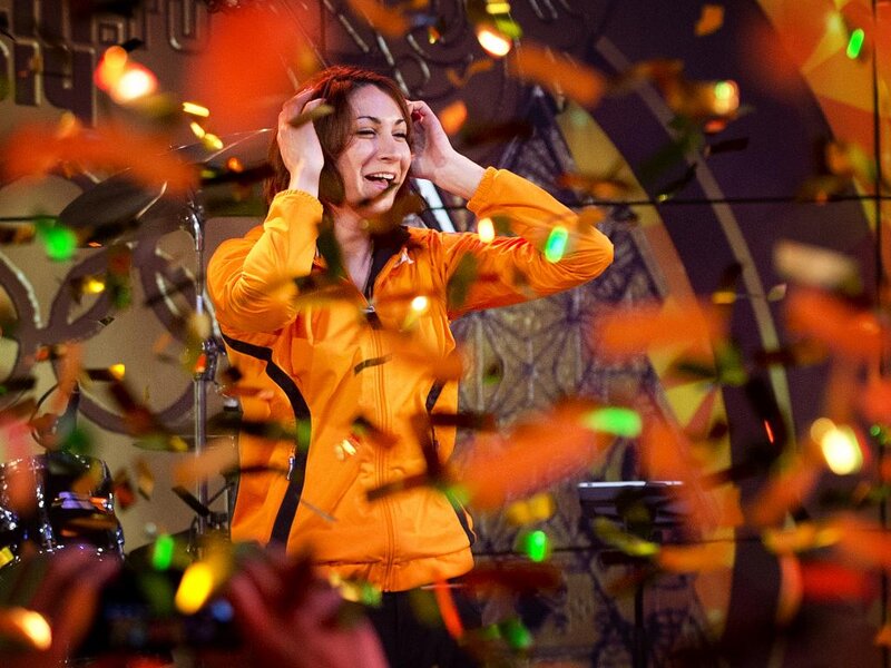 Woman in Orange Jacket — Festive