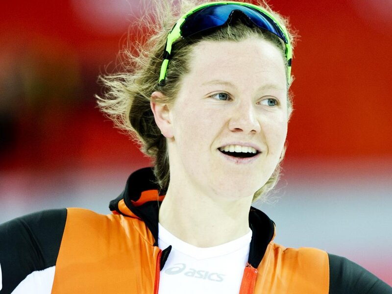 Woman in Orange Jacket — Focused, Photograph
