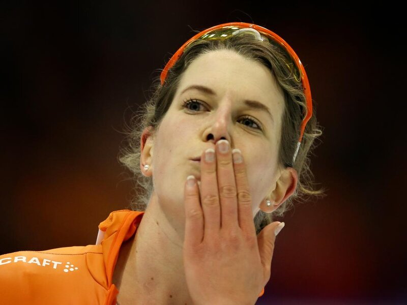 Woman in Orange Jacket — Focused