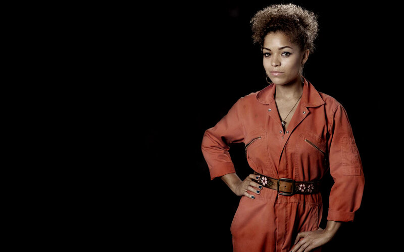 Woman in Orange Jumpsuit — Confident