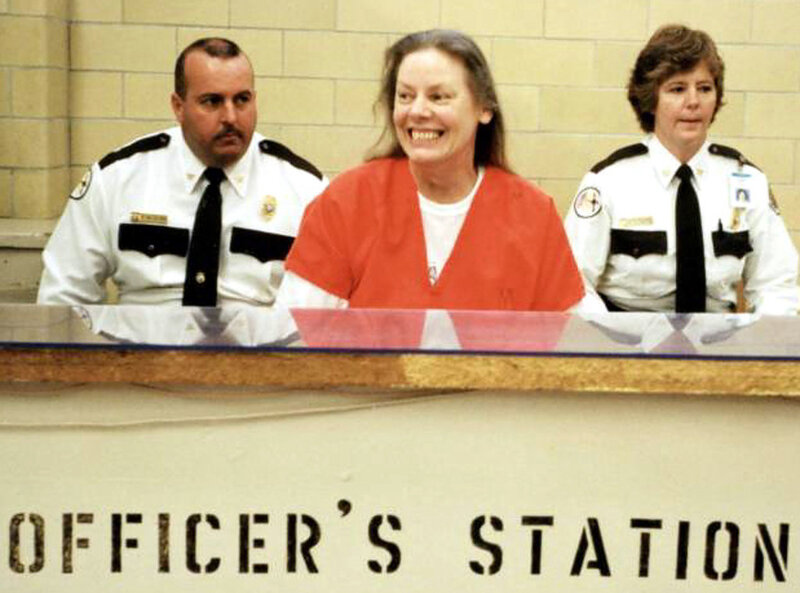 Woman in Orange Jumpsuit — Serious