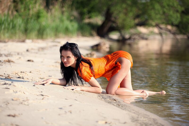 woman in orange on beach