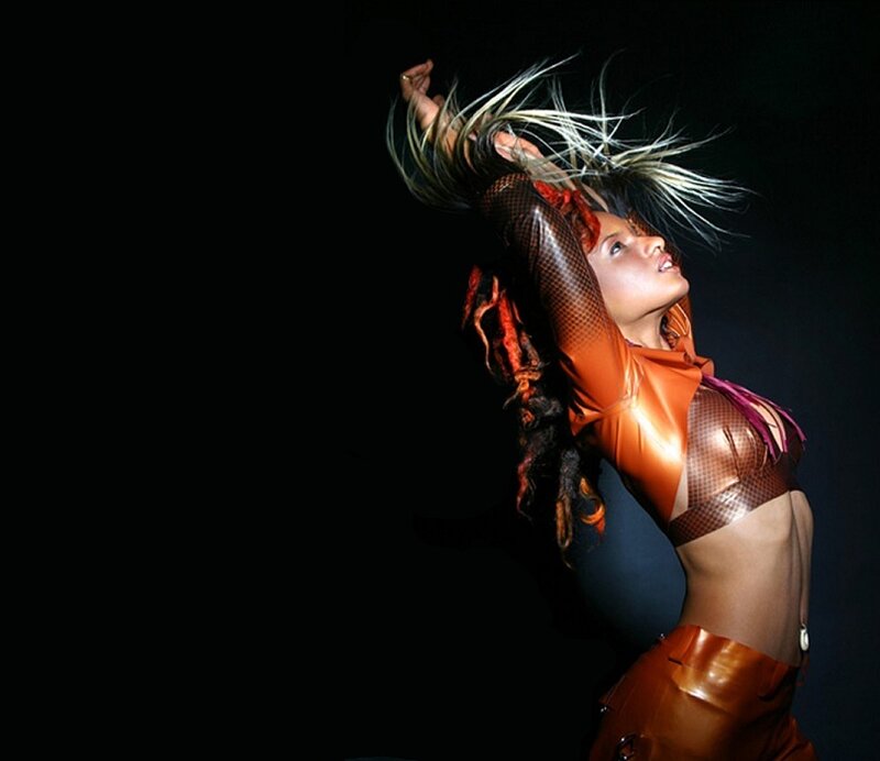 Woman in Orange Outfit — Dramatic