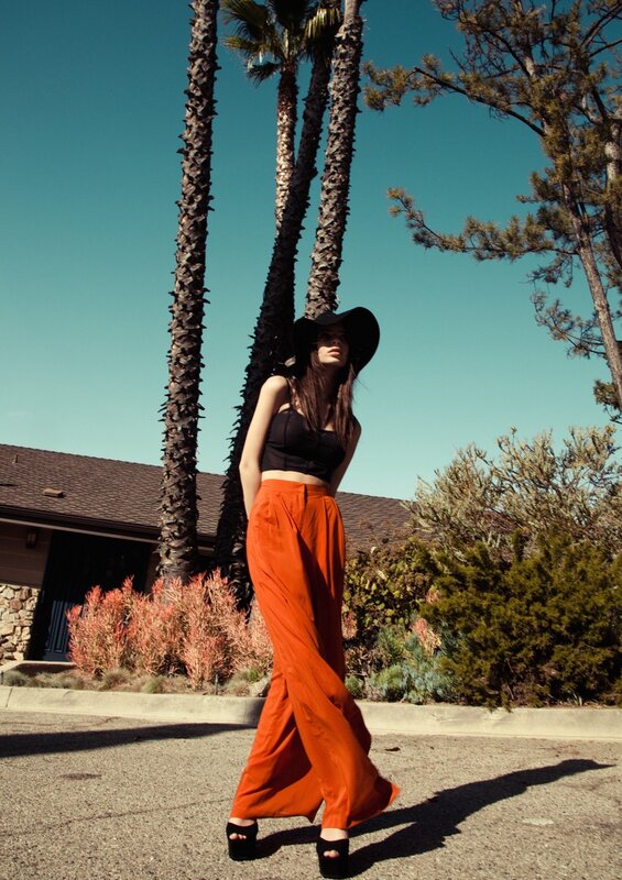 woman in orange pants and hat