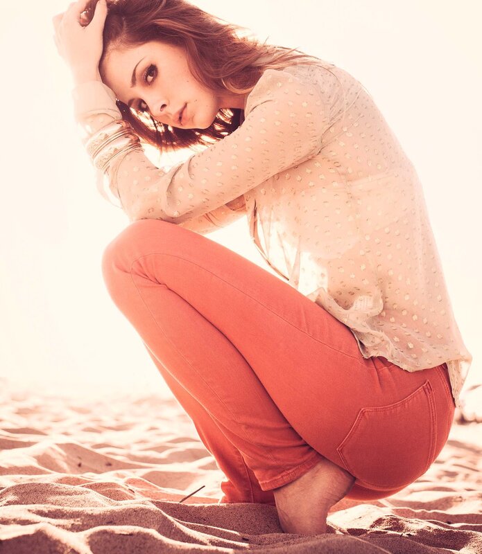 woman in orange pants on beach