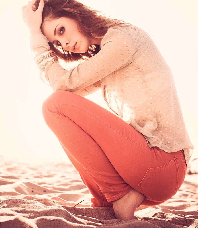 woman in orange pants on beach