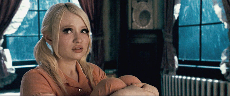 woman in orange shirt sitting