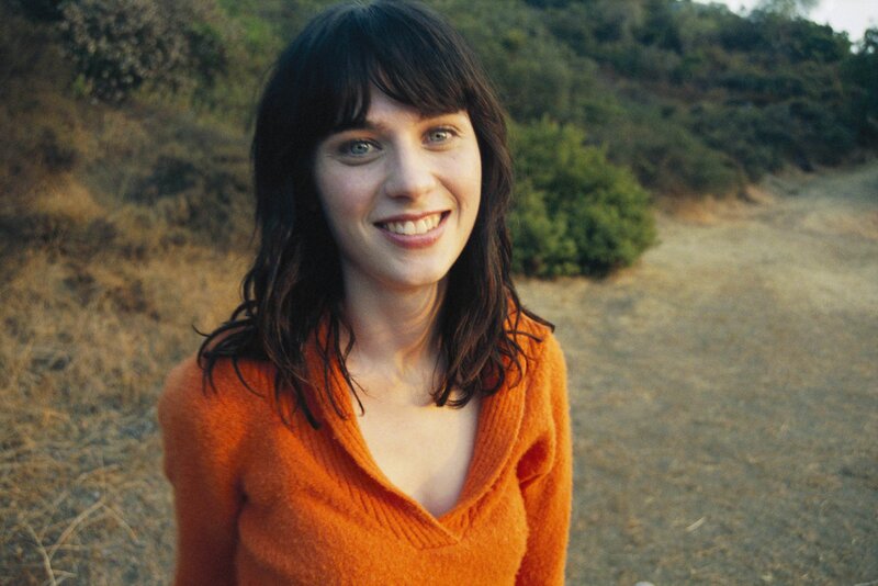 woman in orange sweater
