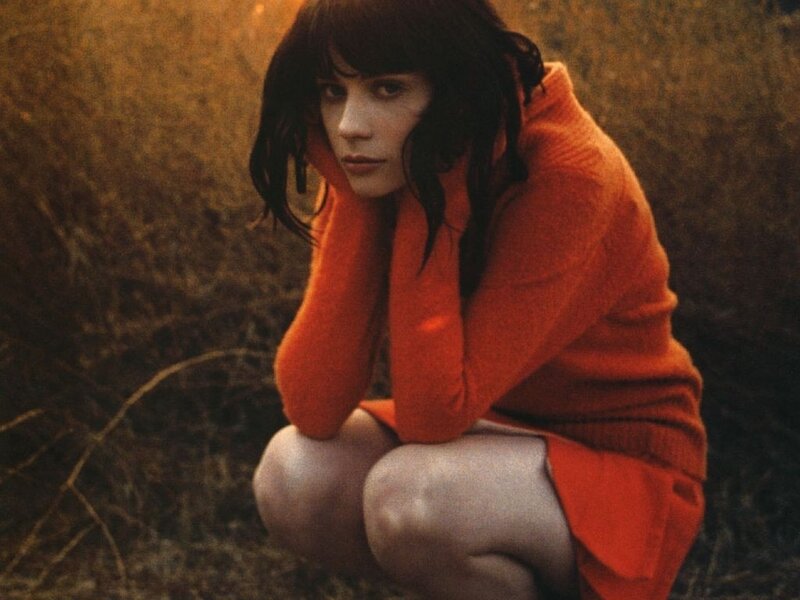 Woman in Orange Sweater — Dramatic