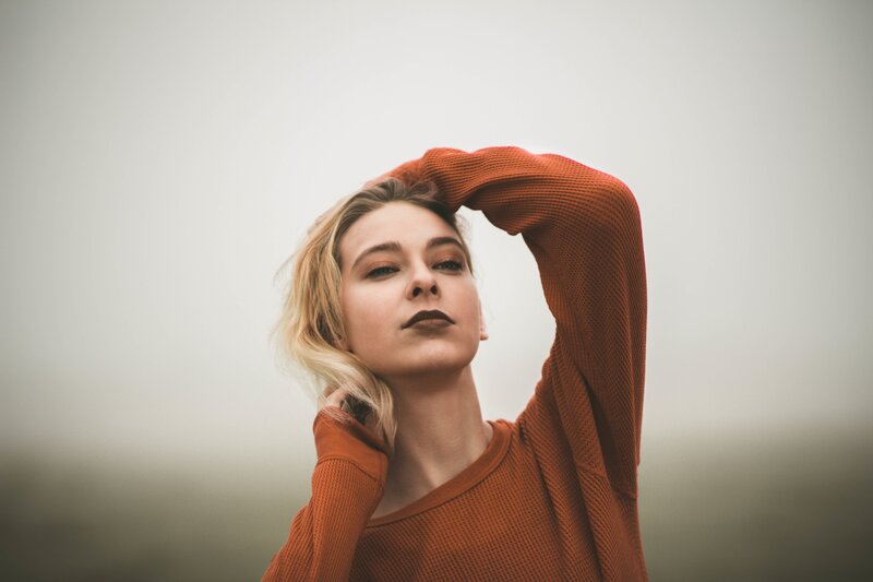 woman in orange sweater