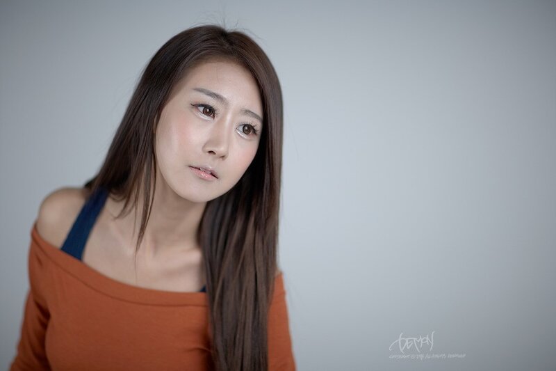 woman in orange top
