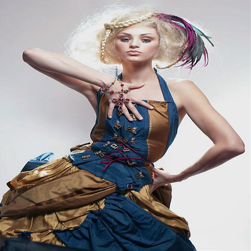 woman in ornate blue and gold dress