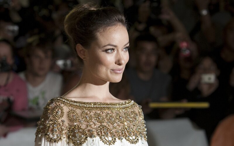 woman in ornate dress on red carpet