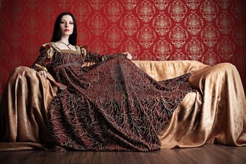 Woman in Ornate Dress — Red, Dramatic, Photograph, Couch