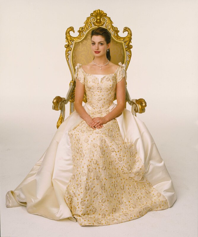 woman in ornate gown on throne